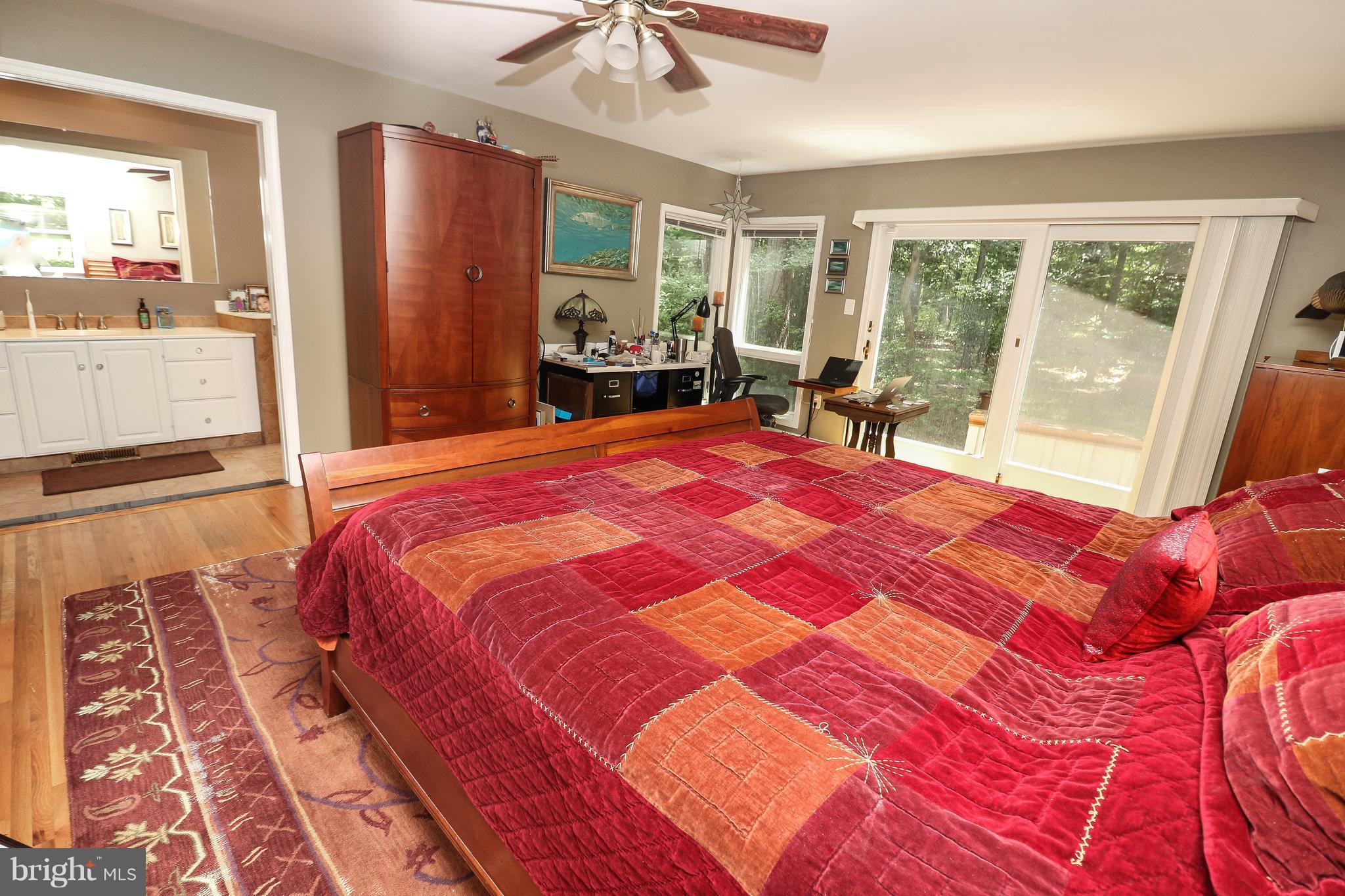 12003 Whip Road Reston, VA 20191 - Photo 14 of 28 a bedroom with a large bed and a dresser