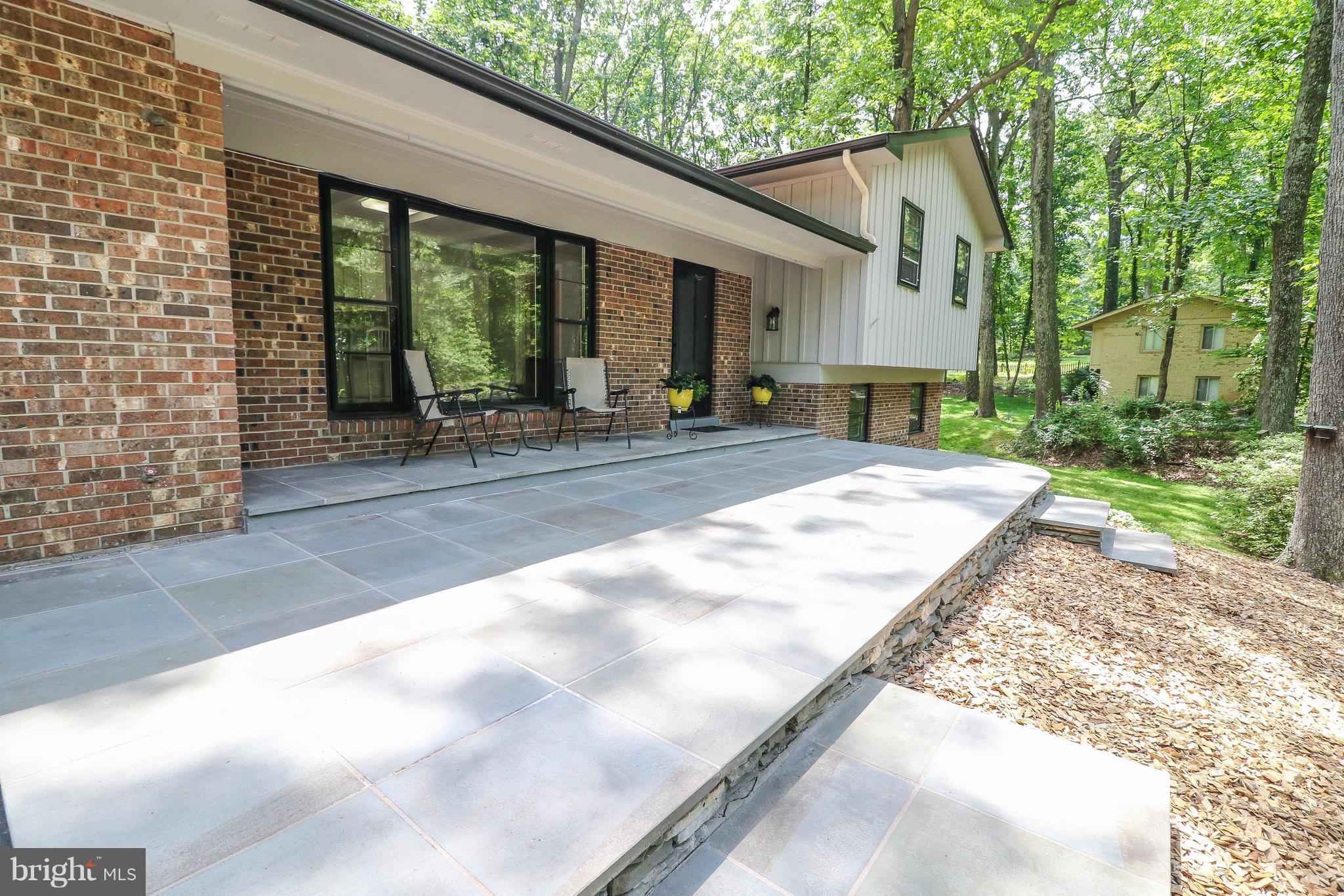 12003 Whip Road Reston, VA 20191 - Photo 3 of 28 a view of house with backyard and outdoor space