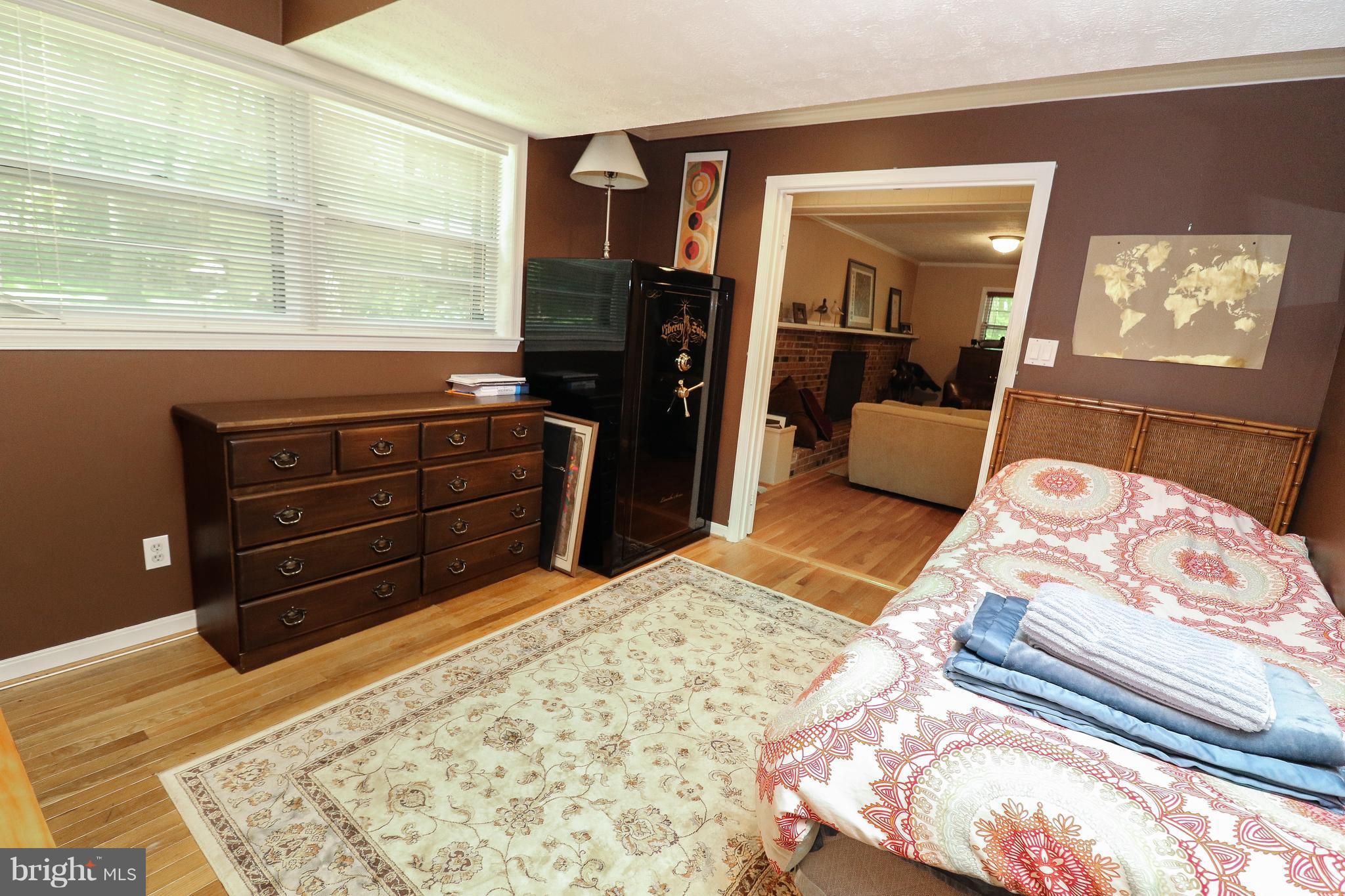 12003 Whip Road Reston, VA 20191 - Photo 22 of 28 a bedroom with a bed and a dresser