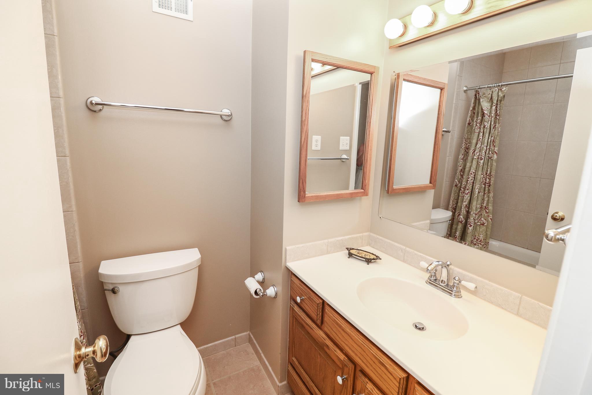 12003 Whip Road Reston, VA 20191 - Photo 23 of 28 a bathroom with a sink toilet and shower