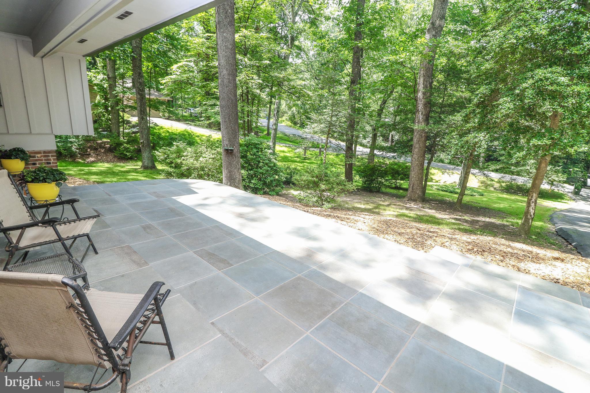 12003 Whip Road Reston, VA 20191 - Photo 4 of 28 a view of a backyard with a patio