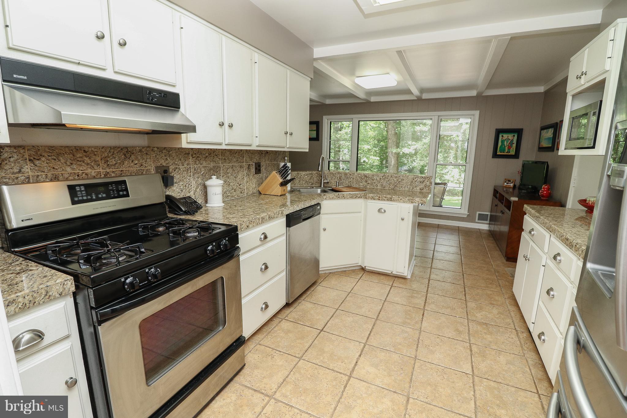 12003 Whip Road Reston, VA 20191 - Photo 5 of 28 a kitchen with a stove a sink and a refrigerator