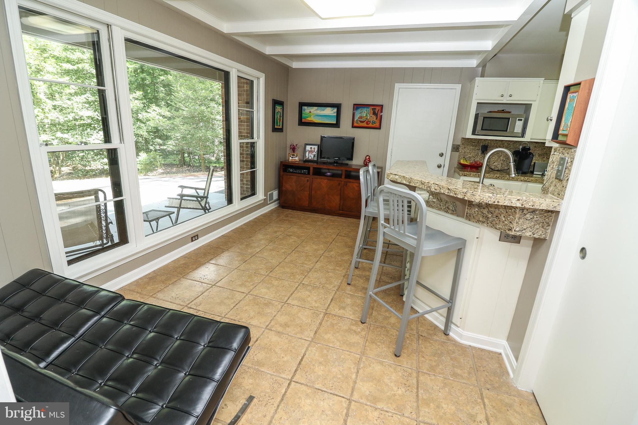 12003 Whip Road Reston, VA 20191 - Photo 8 of 28 a living room with a couch and a table