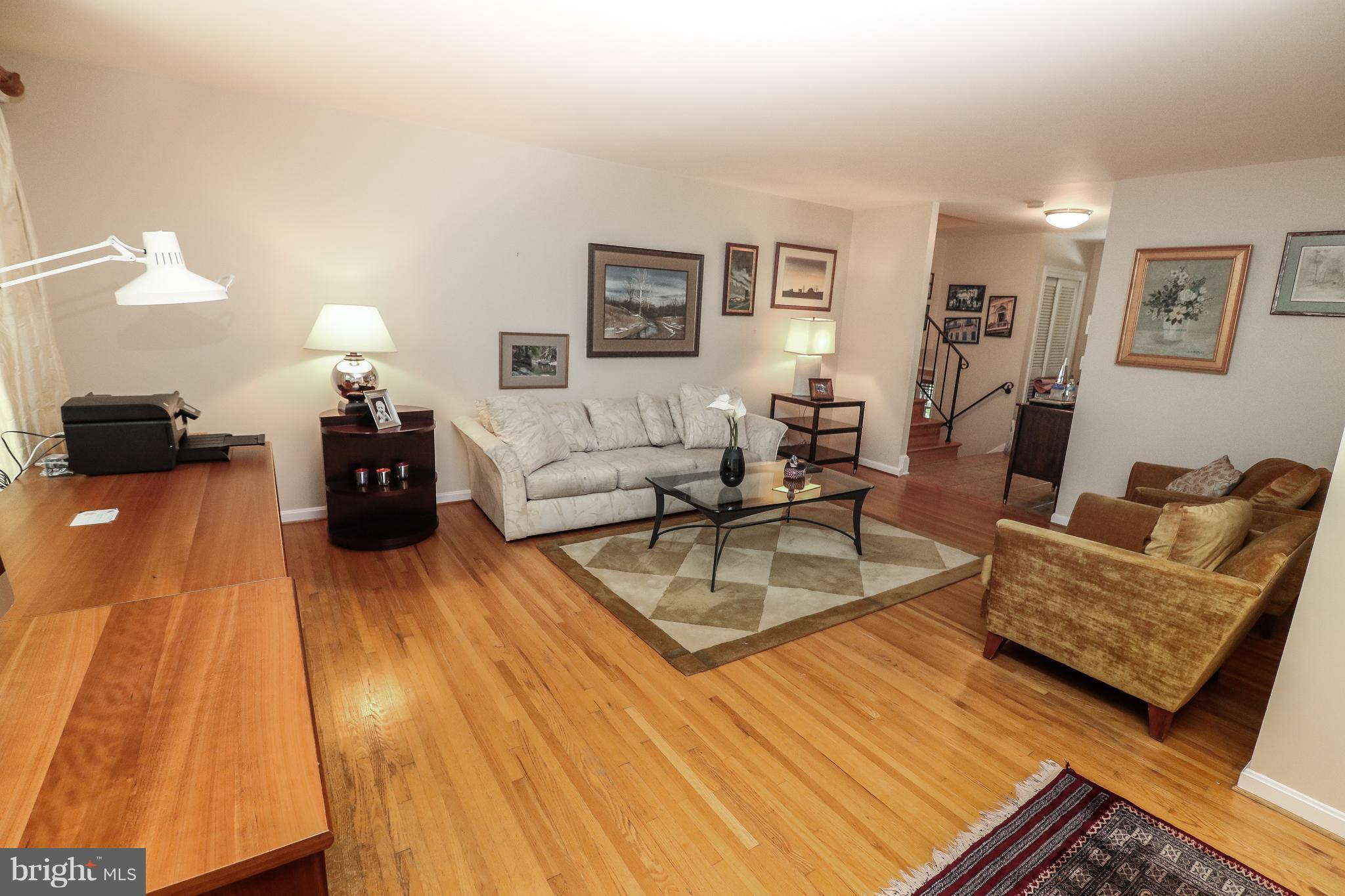 12003 Whip Road Reston, VA 20191 - Photo 10 of 28 a living room with furniture and wooden floor
