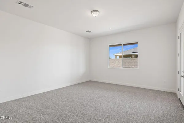 an empty room with a empty space and windows