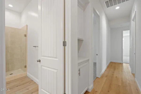 a view of a bathroom from the hallway