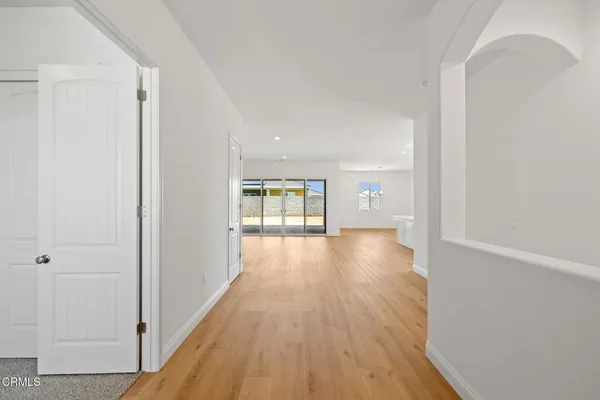 a view of gallery with wooden floor