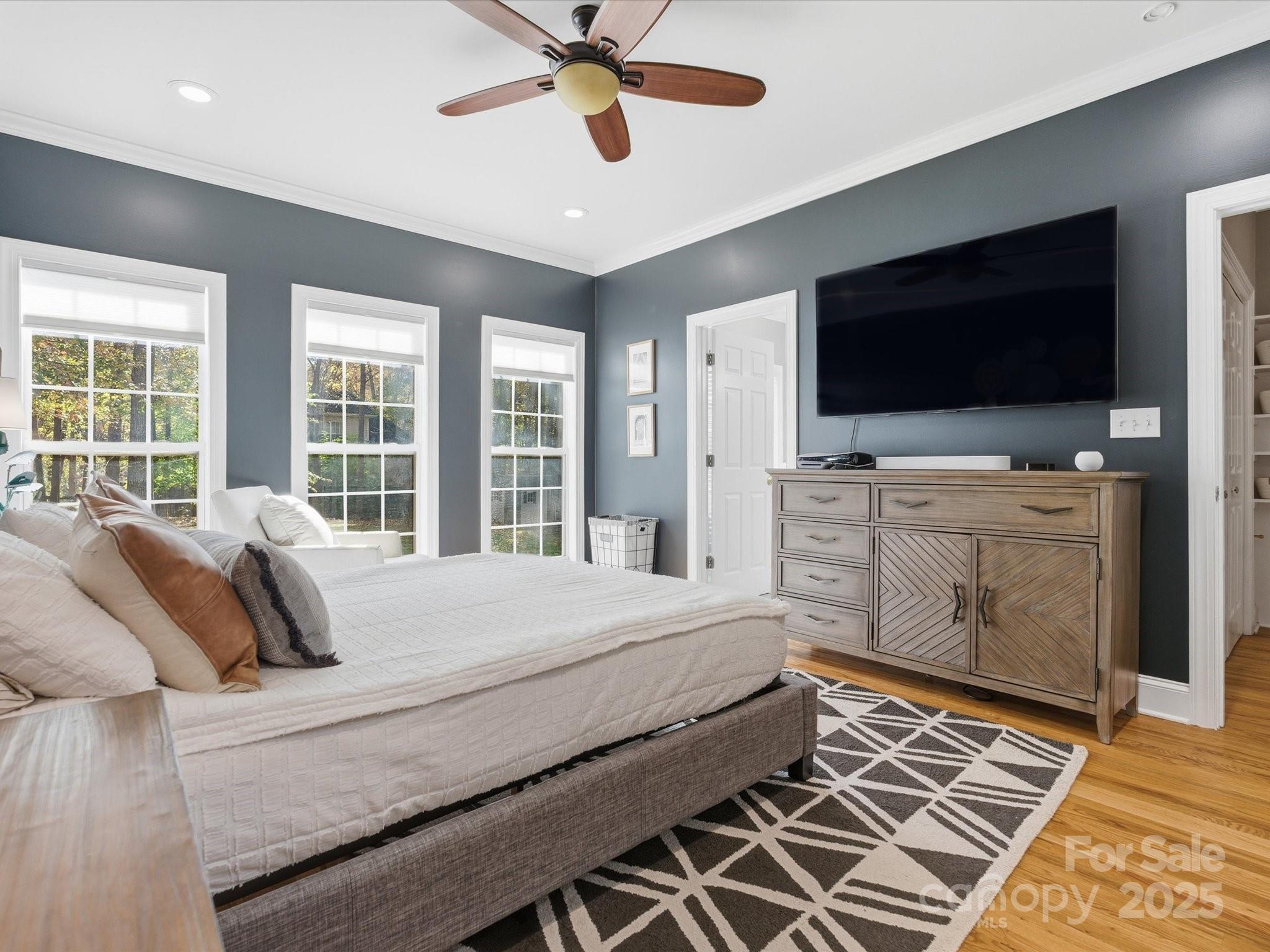 4601 Magnolia Ridge Drive Waxhaw, NC 28173 - Photo 22 of 48 a bedroom with a bed and a flat screen tv