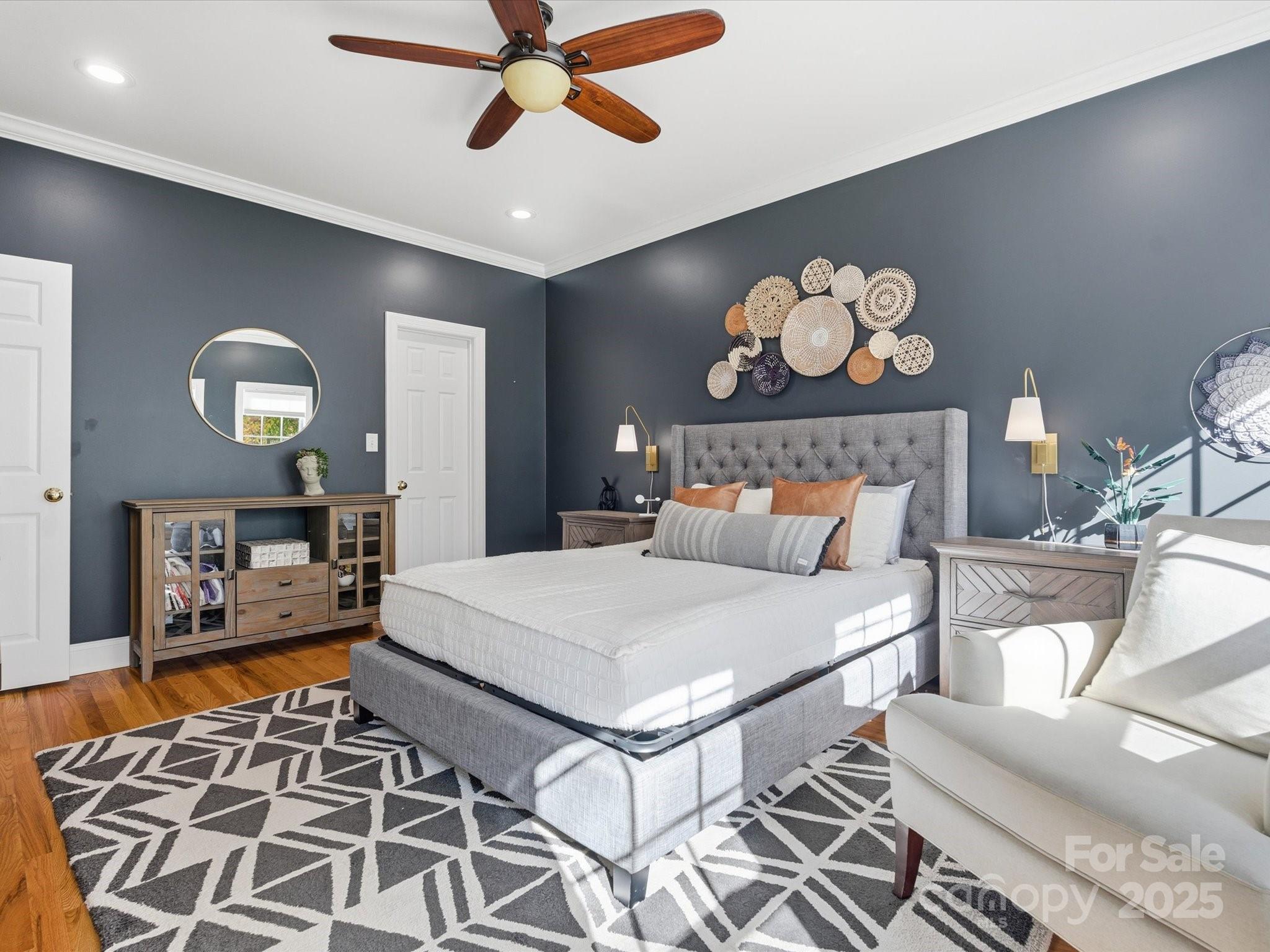 4601 Magnolia Ridge Drive Waxhaw, NC 28173 - Photo 23 of 48 a bedroom with a bed and wooden floor