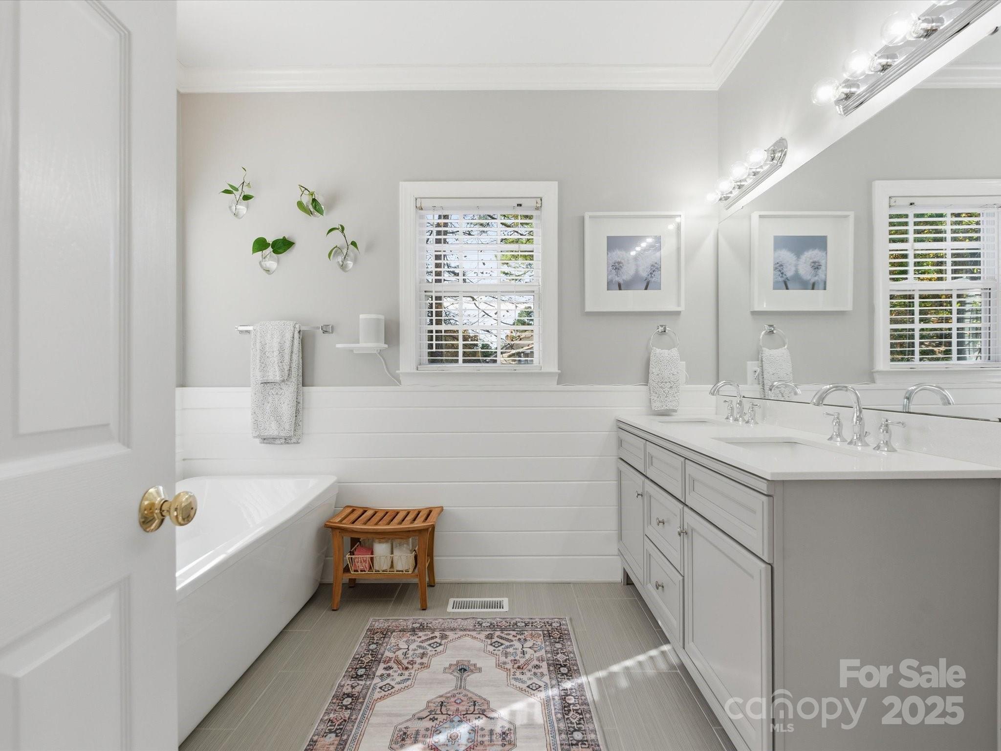 4601 Magnolia Ridge Drive Waxhaw, NC 28173 - Photo 25 of 48 a bathroom with a tub sink and mirror