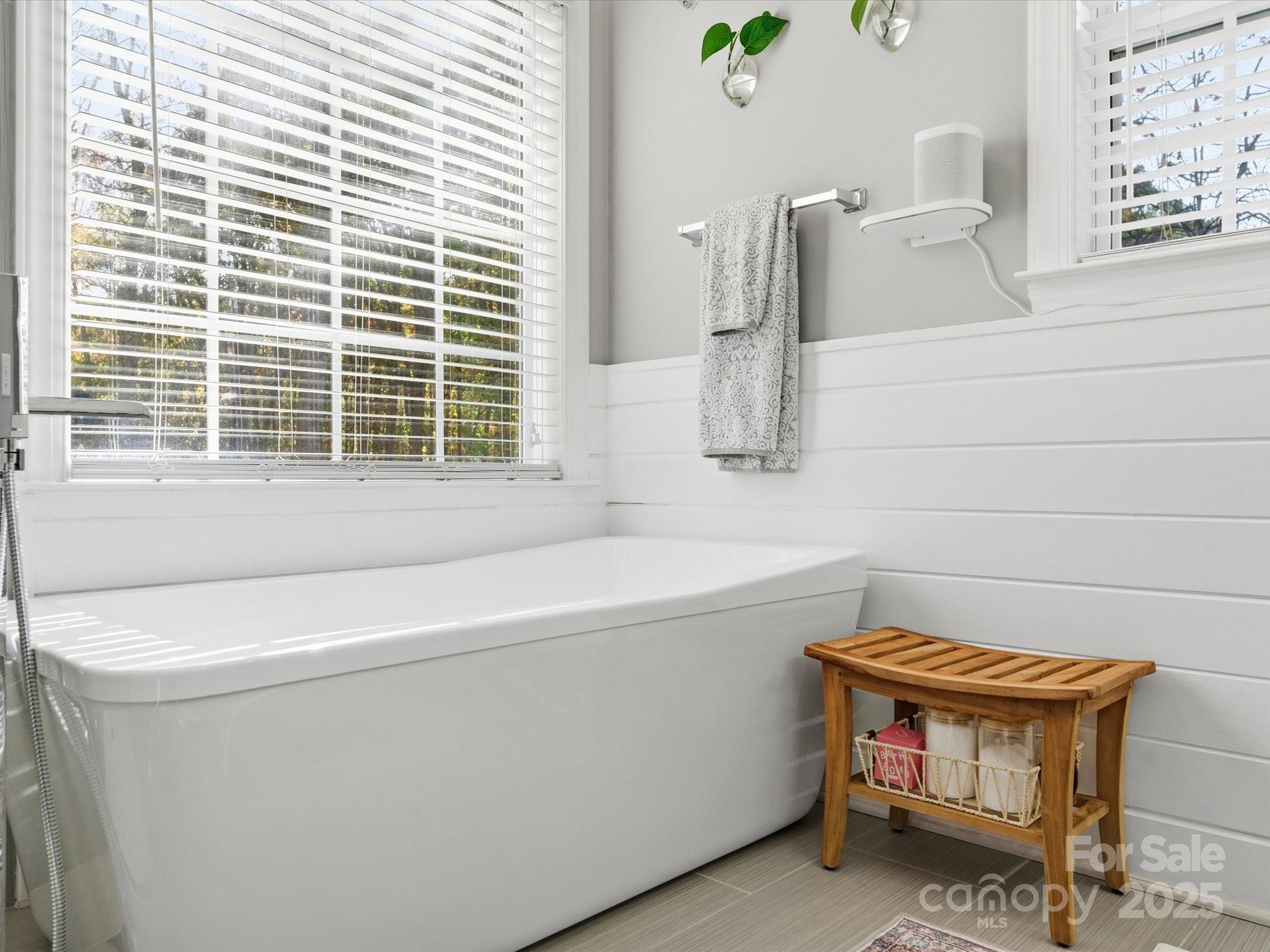4601 Magnolia Ridge Drive Waxhaw, NC 28173 - Photo 27 of 48 a bathroom with a bathtub and next to a window