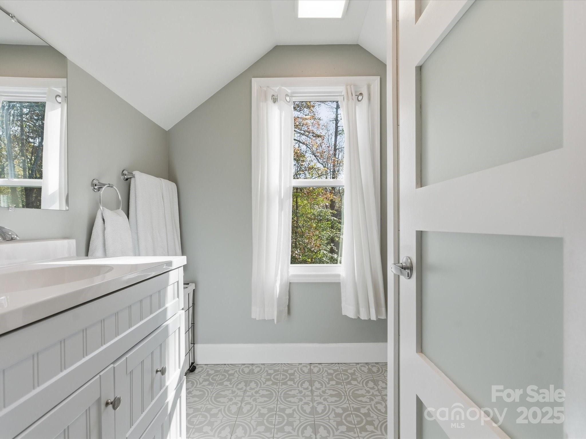 4601 Magnolia Ridge Drive Waxhaw, NC 28173 - Photo 34 of 48 a view of bathroom with a sink cabinet and a mirror