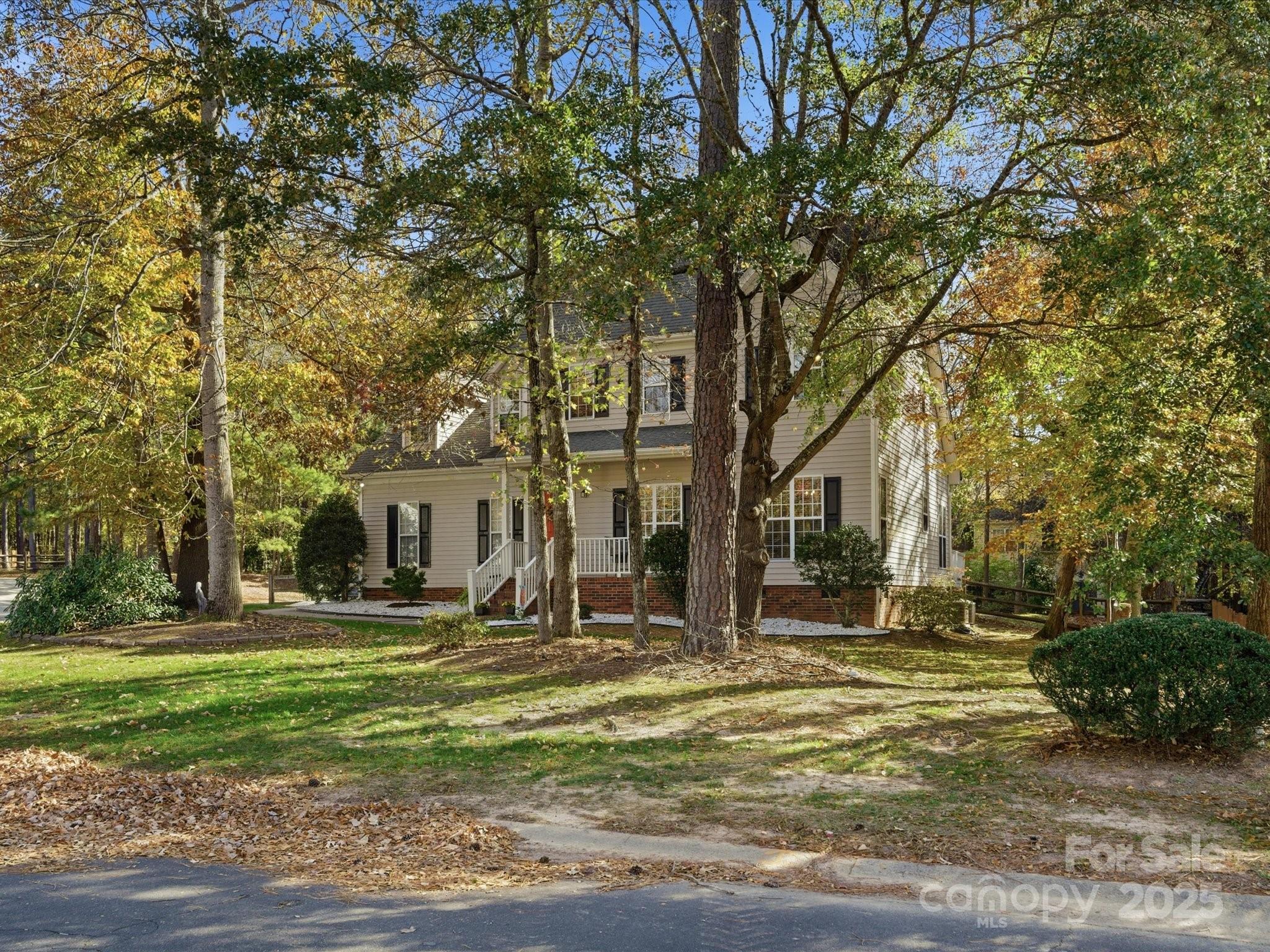 4601 Magnolia Ridge Drive Waxhaw, NC 28173 - Photo 43 of 48 a front view of a house with a yard