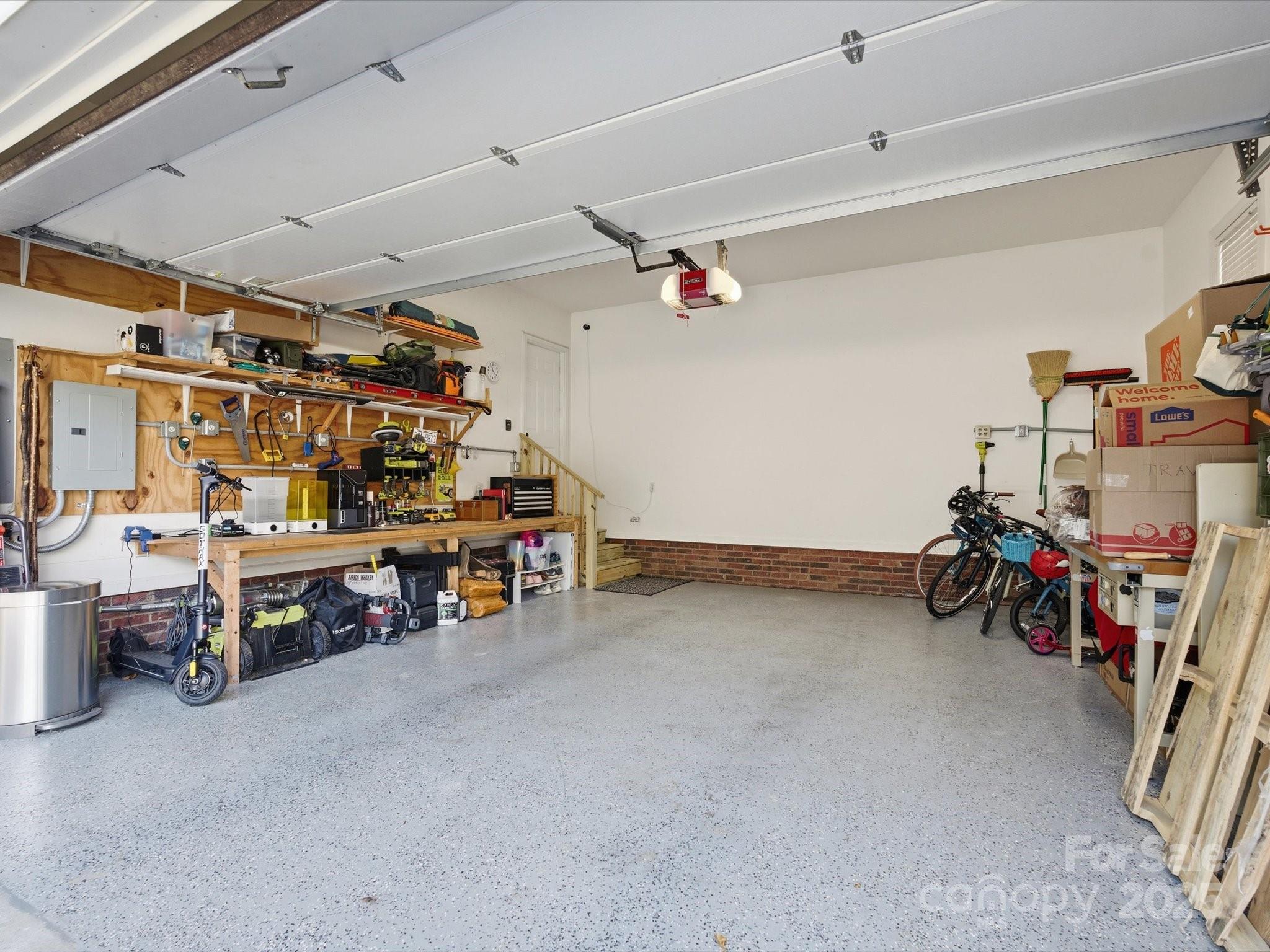4601 Magnolia Ridge Drive Waxhaw, NC 28173 - Photo 44 of 48 a view of a garage with a bike and white walls
