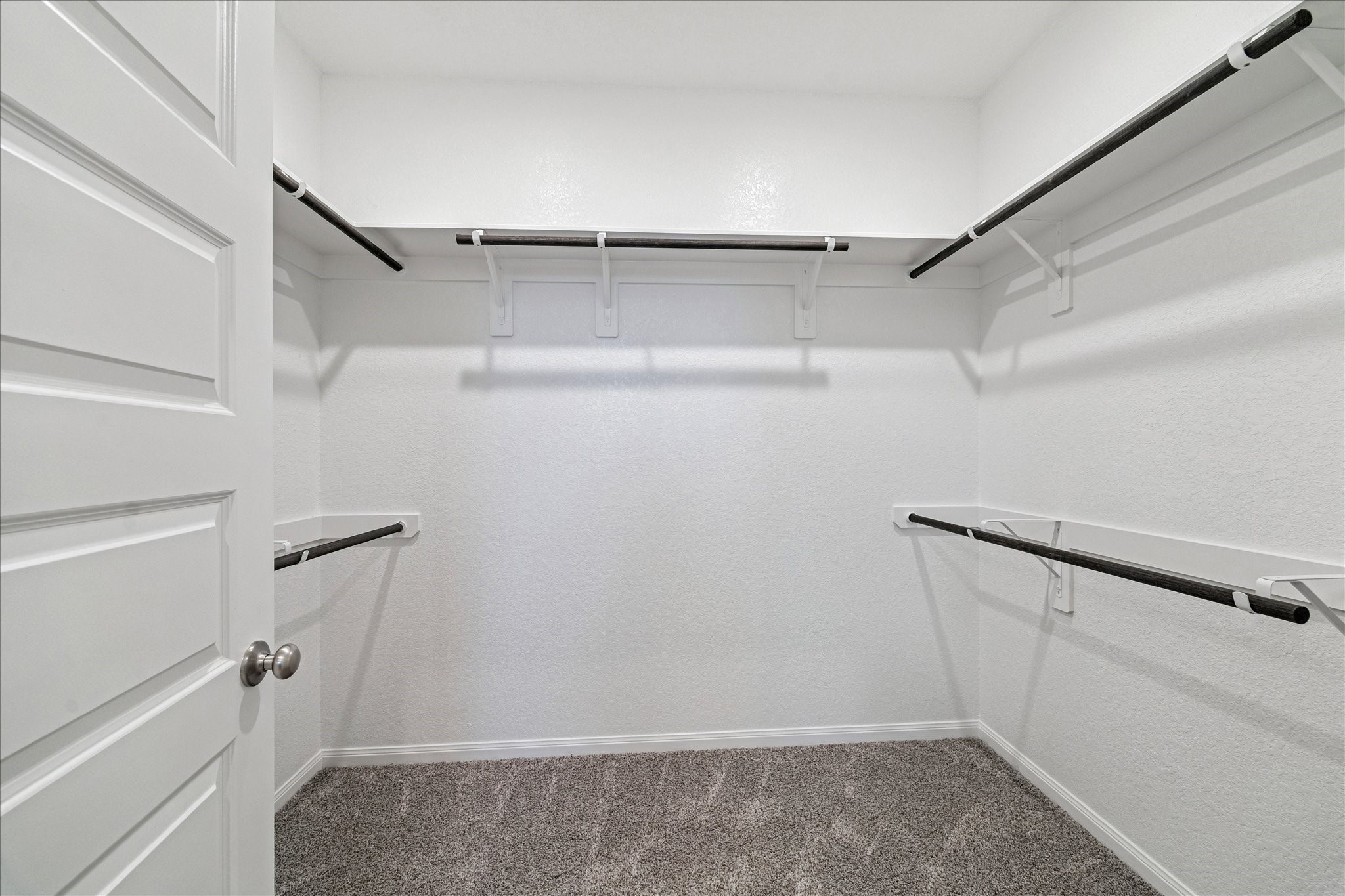 5502 Cuerta Street Houston, TX 77023 - Photo 14 of 25 Amazing walk-in closet perfect to house all your wardrobe finds with plenty of upper shelving for storage.