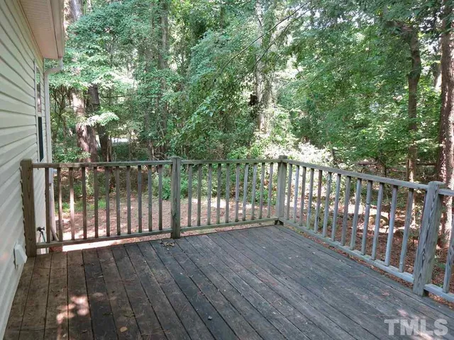 a view of deck with wooden floor and fence