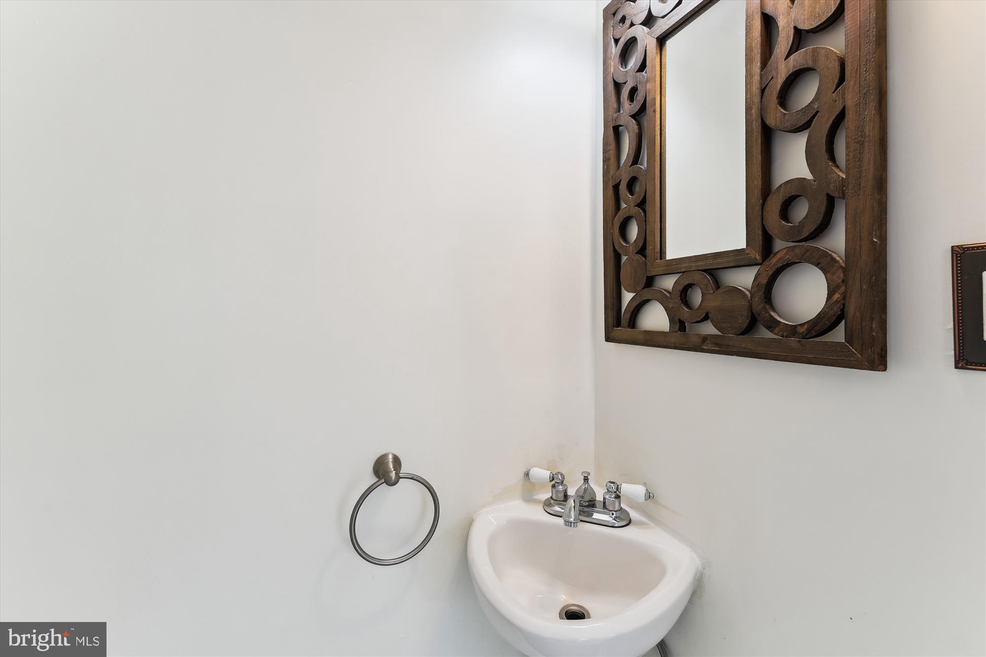 501 Dunkirk Road Baltimore, MD 21212 - Photo 15 of 38 a bathroom with a sink and mirror