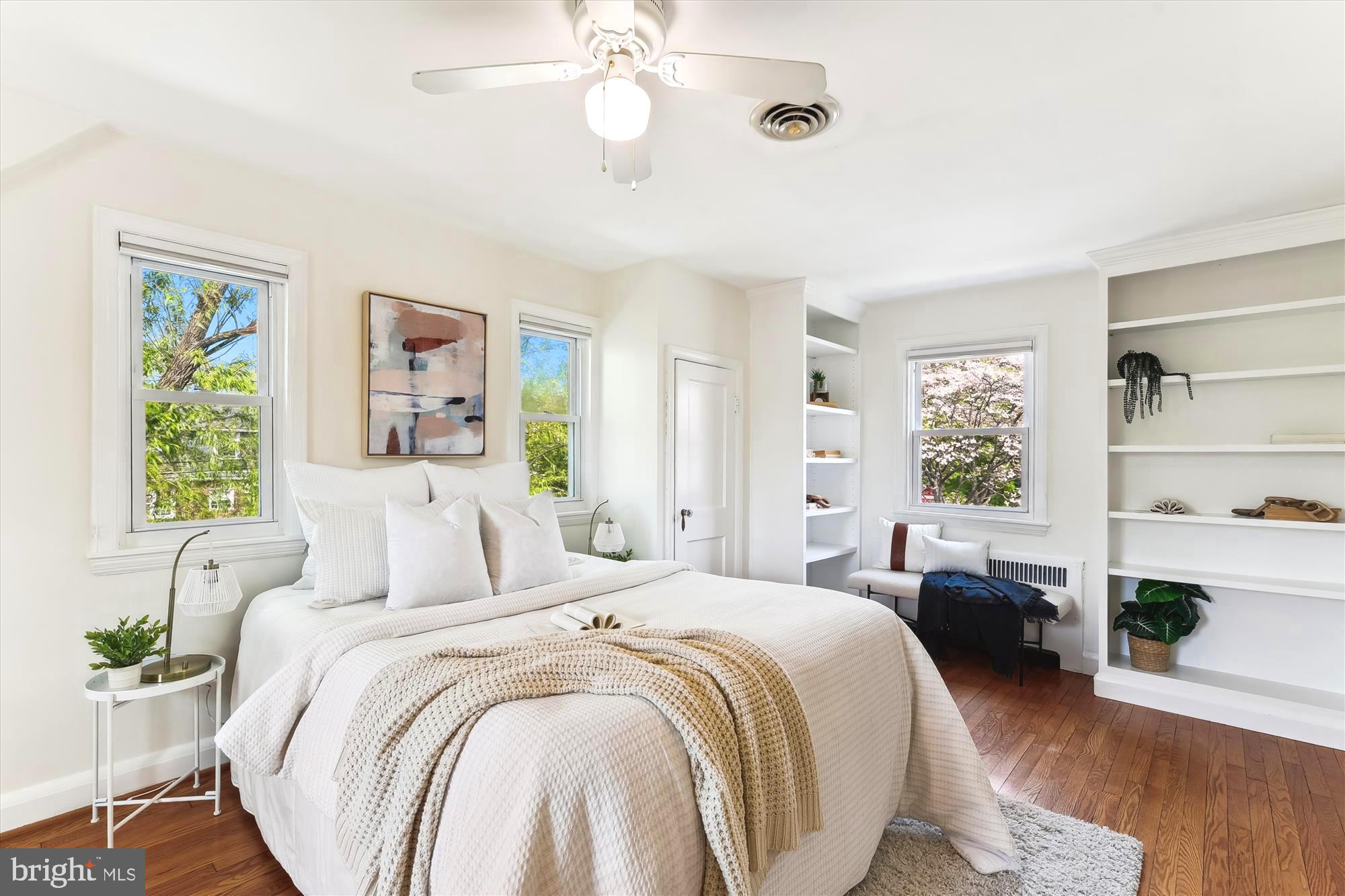 501 Dunkirk Road Baltimore, MD 21212 - Photo 16 of 38 a bedroom with a bed wooden floor and window