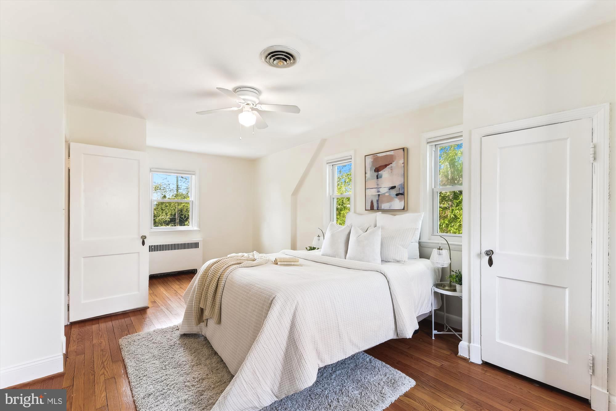 501 Dunkirk Road Baltimore, MD 21212 - Photo 17 of 38 a bedroom with a bed mirror and a window