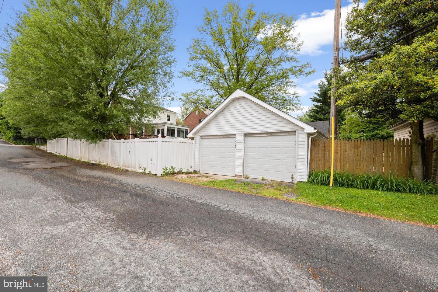 501 Dunkirk Road Baltimore, MD 21212 - Photo 32 of 38 a house with a yard and a large tree