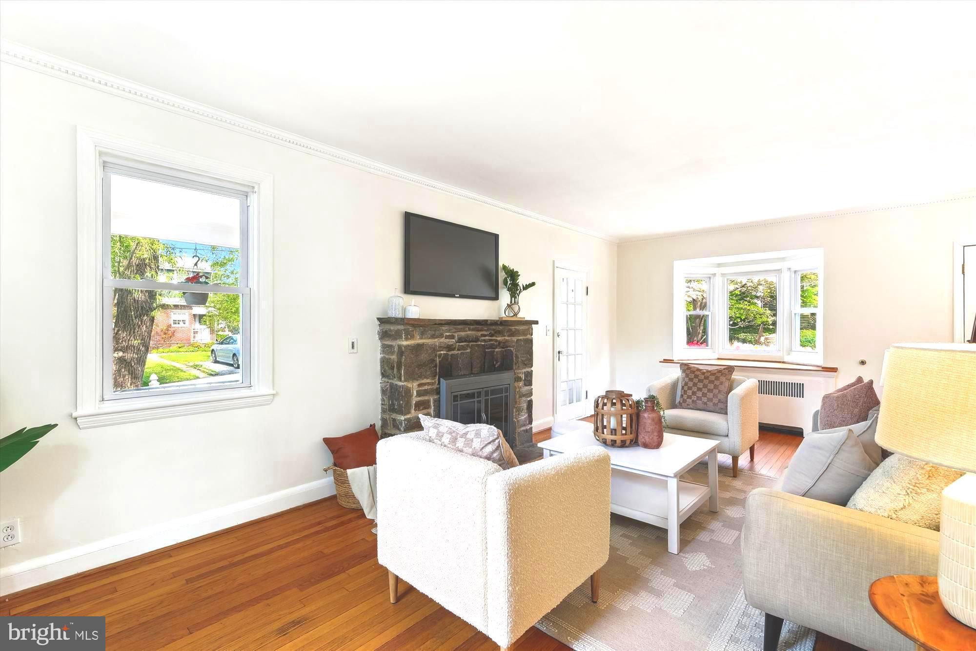 501 Dunkirk Road Baltimore, MD 21212 - Photo 6 of 38 a living room with fireplace furniture and a flat screen tv