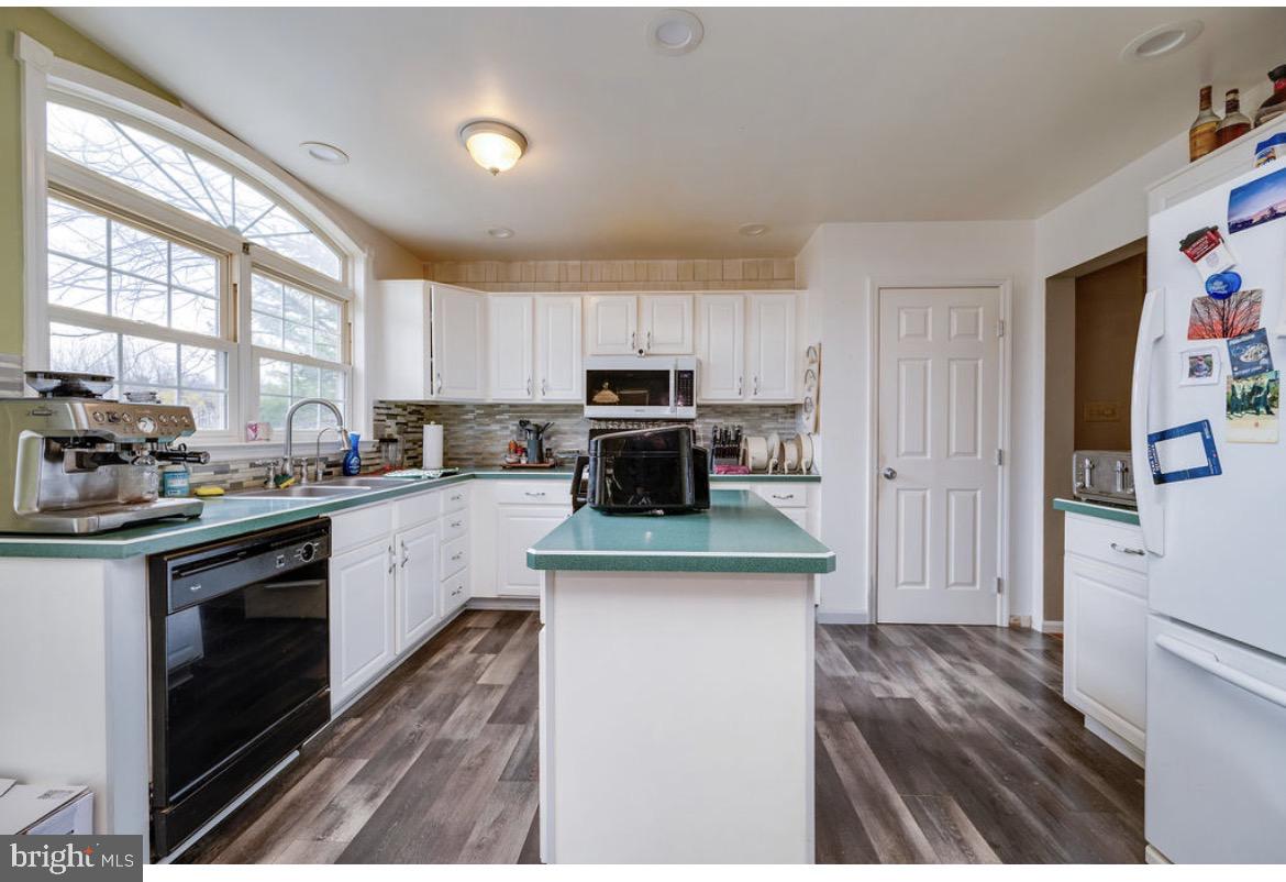 390 Wingspread Drive Reading, PA 19606 - Photo 14 of 21 a kitchen with granite countertop a refrigerator stove top oven and sink