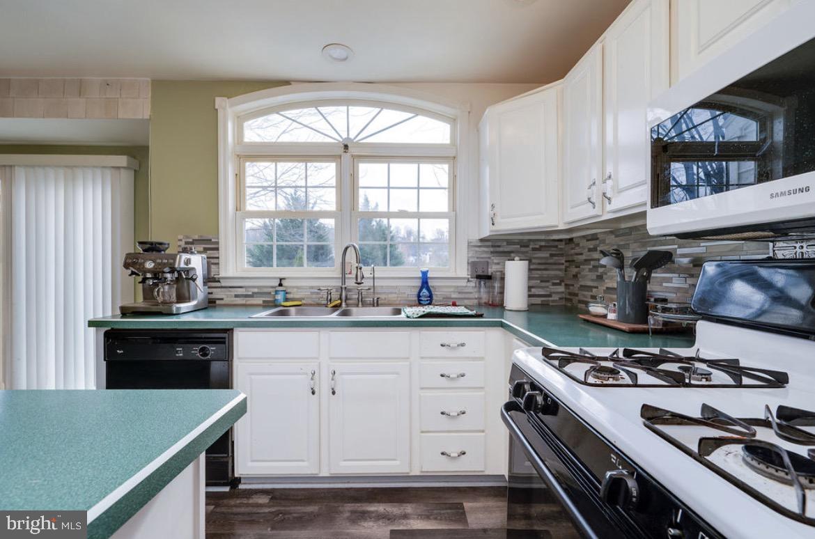 390 Wingspread Drive Reading, PA 19606 - Photo 15 of 21 a kitchen with granite countertop a stove and a sink