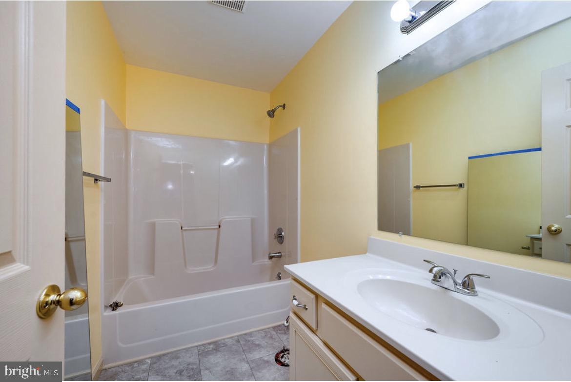 390 Wingspread Drive Reading, PA 19606 - Photo 19 of 21 a bathroom with a sink and a mirror