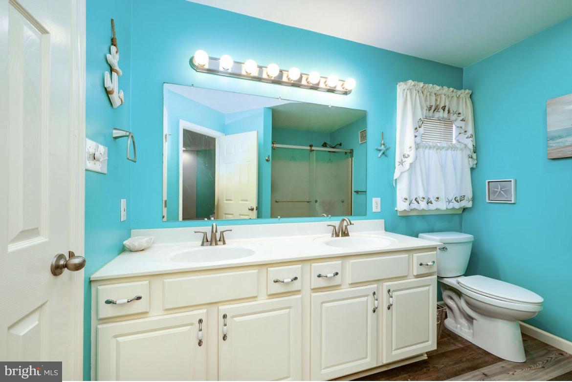 390 Wingspread Drive Reading, PA 19606 - Photo 20 of 21 a bathroom with a double vanity sink mirror and toilet