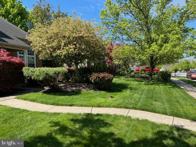 390 Wingspread Drive Reading, PA 19606 - Photo 3 of 21 a view of a house with a garden and pathway
