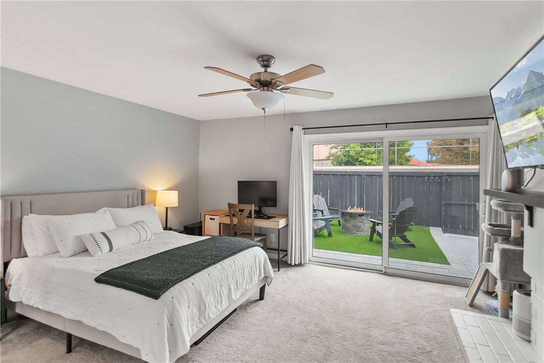 1404 North Tustin Avenue, Unit E2 Santa Ana, CA 92705 - Photo 14 of 27 a spacious bedroom with a bed and a desk