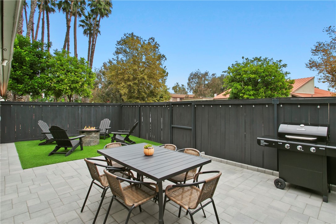 1404 North Tustin Avenue, Unit E2 Santa Ana, CA 92705 - Photo 22 of 27 a backyard of a house with table and chairs