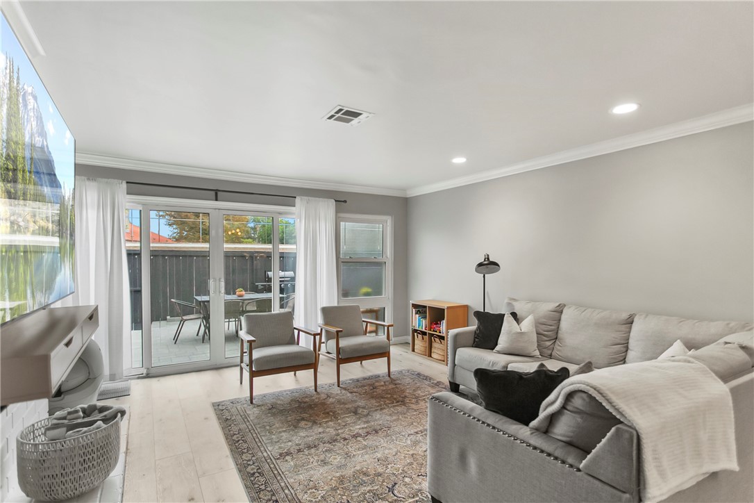 1404 North Tustin Avenue, Unit E2 Santa Ana, CA 92705 - Photo 7 of 27 a living room with furniture and a large window