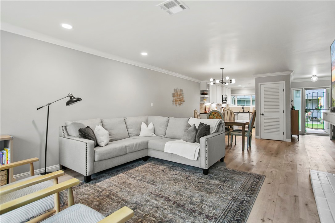 1404 North Tustin Avenue, Unit E2 Santa Ana, CA 92705 - Photo 8 of 27 a living room with furniture and wooden floor