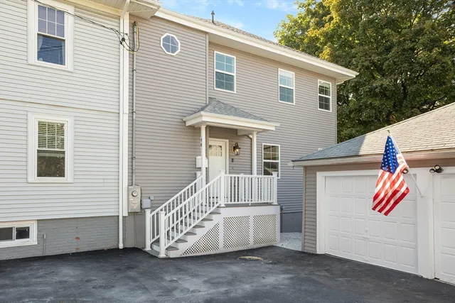a front view of a house with a garage
