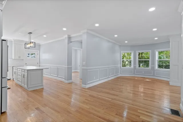 a view of kitchen with window and wooden floor