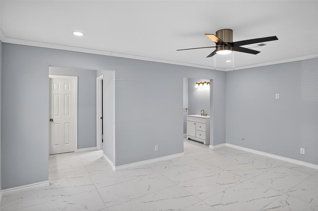 835 38th Street Southeast Paris, TX 75462 - Photo 13 of 25 a view of a livingroom with a chandelier fan and windows