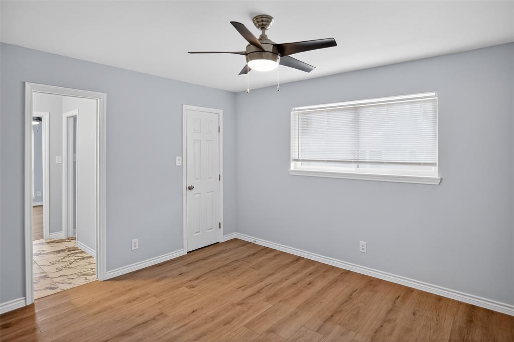 835 38th Street Southeast Paris, TX 75462 - Photo 16 of 25 a view of empty room with wooden floor and fan