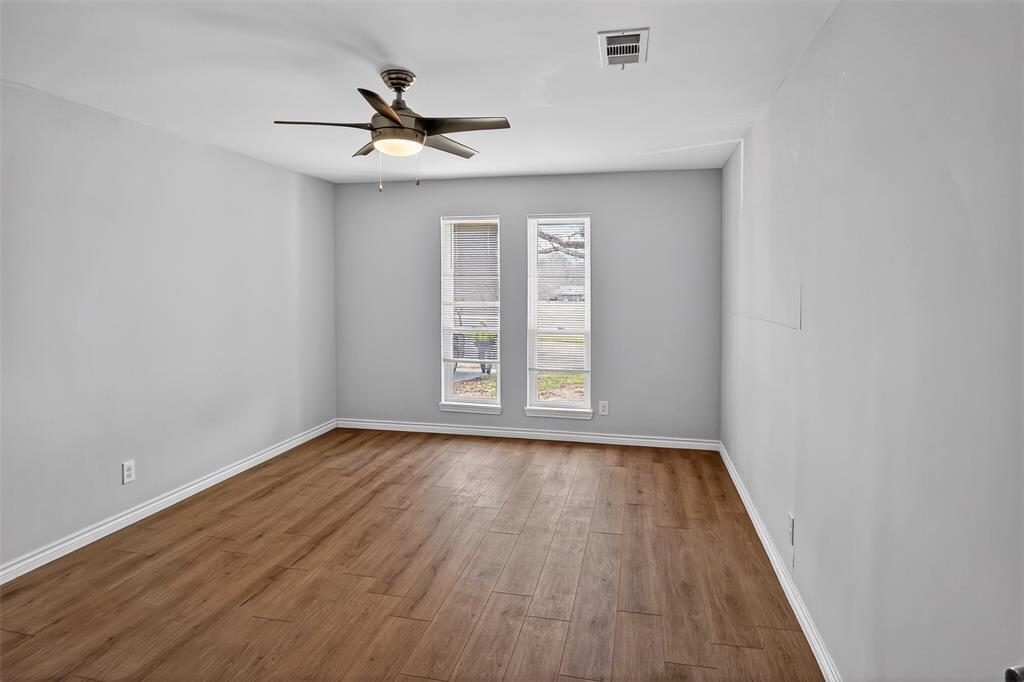 835 38th Street Southeast Paris, TX 75462 - Photo 20 of 25 a view of empty room with wooden floor and fan