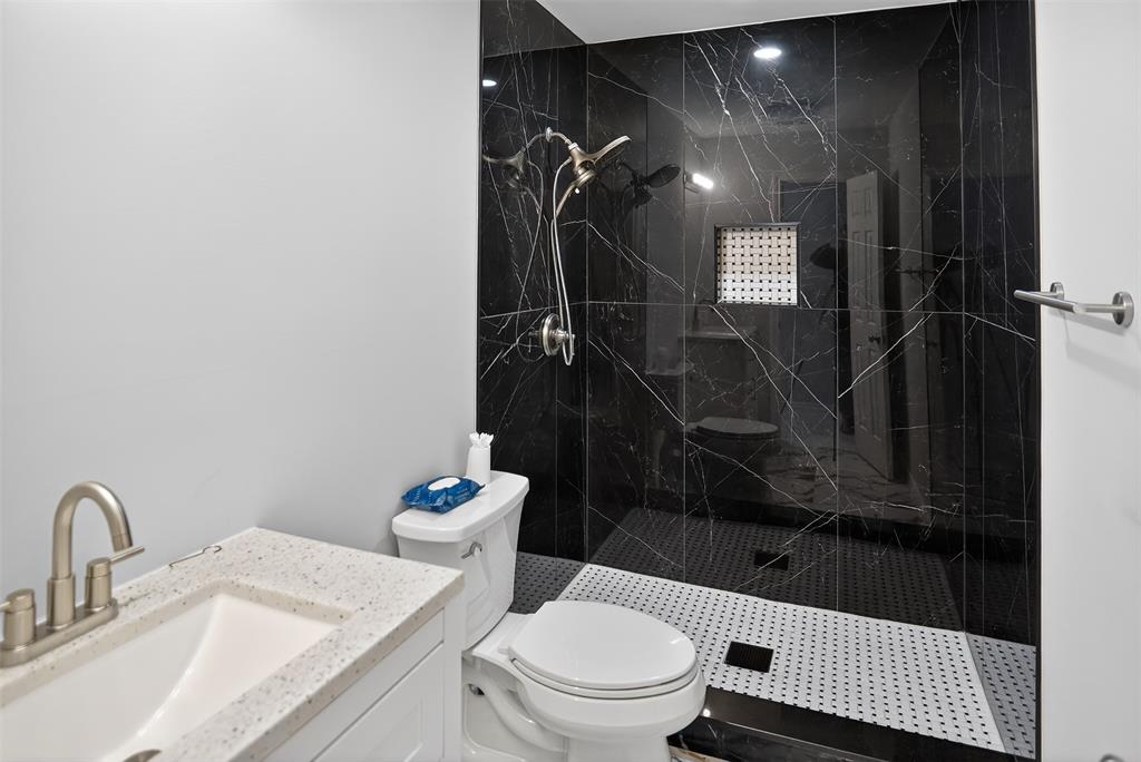 835 38th Street Southeast Paris, TX 75462 - Photo 21 of 25 a bathroom with a sink a toilet and shower