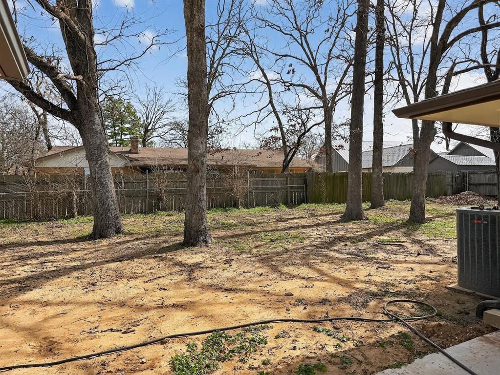 835 38th Street Southeast Paris, TX 75462 - Photo 24 of 25 a view of a yard covered in snow