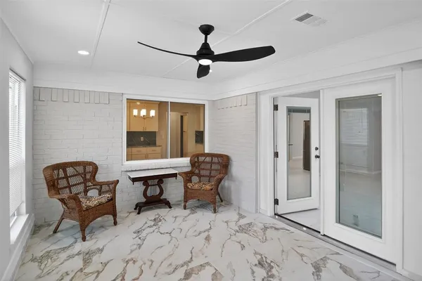 a view of a livingroom with furniture and windows