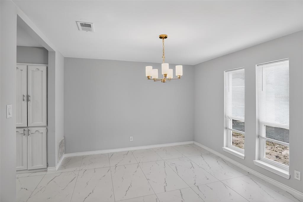 835 38th Street Southeast Paris, TX 75462 - Photo 10 of 25 wooden floor in an empty room with a window