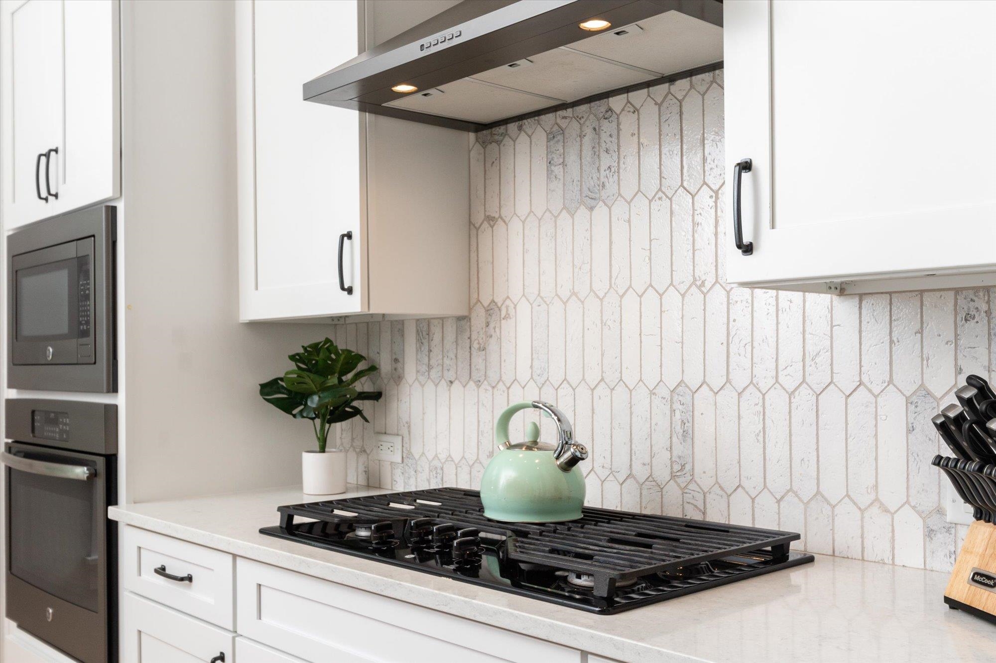 80 Ferrol Road St. Augustine, FL 32084 - Photo 12 of 61 a kitchen with a stove and cabinets