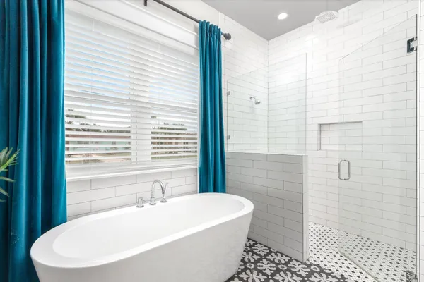 a view of a hallway with wooden floor and entryway