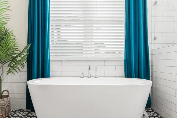 a bathroom with a sink a toilet and shower curtain