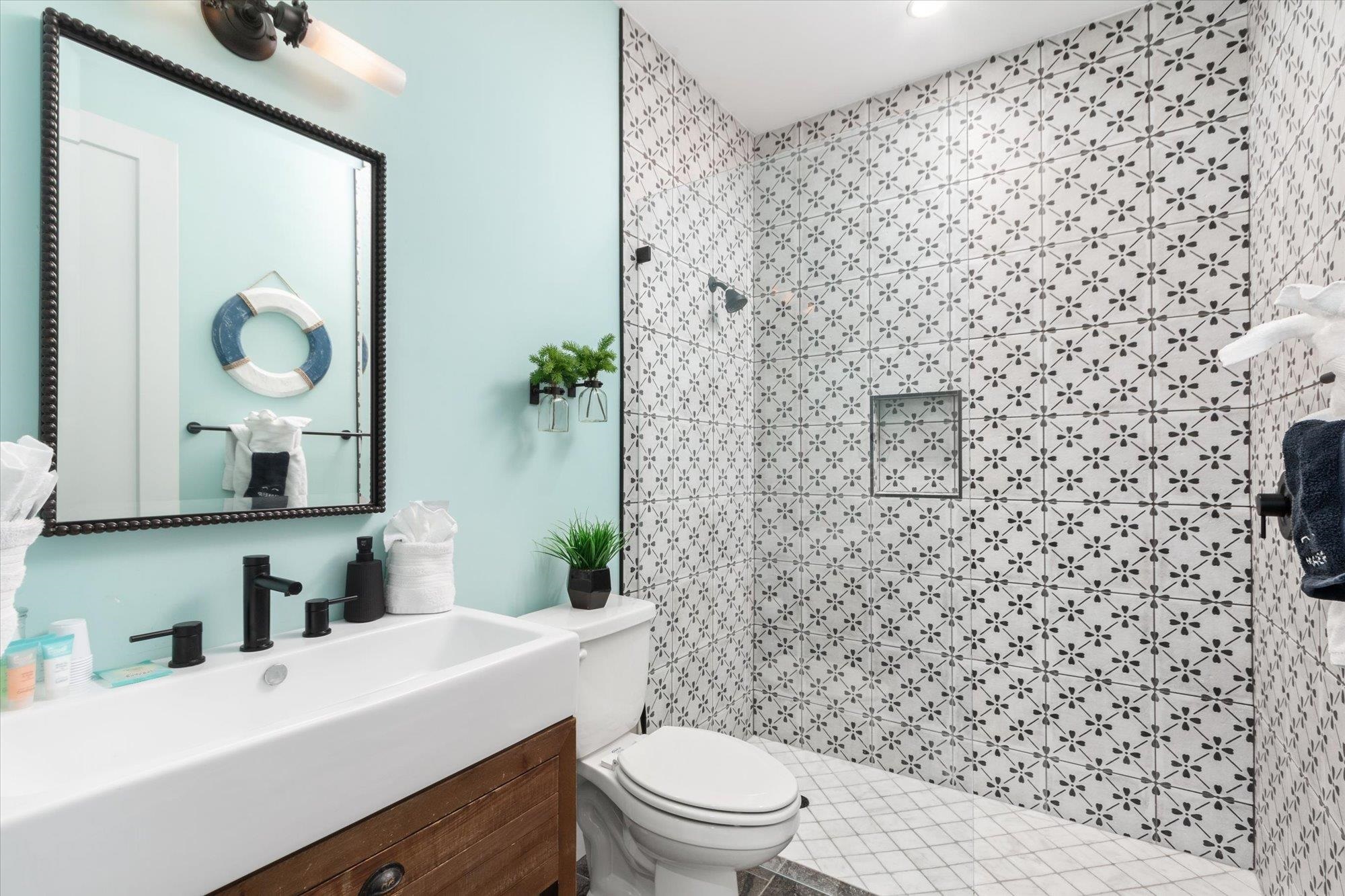 80 Ferrol Road St. Augustine, FL 32084 - Photo 27 of 61 a bathroom with a sink a toilet and shower curtain