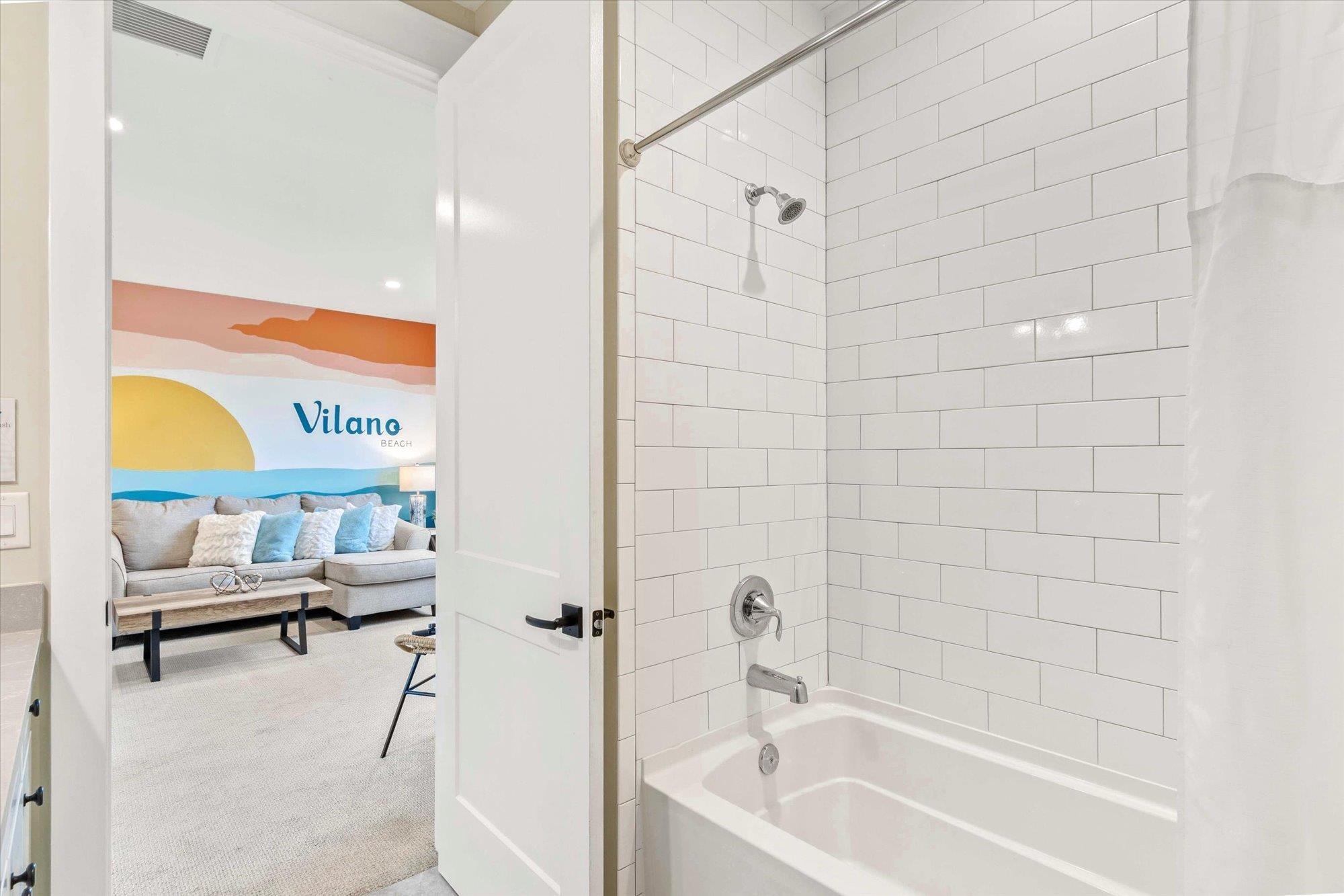 80 Ferrol Road St. Augustine, FL 32084 - Photo 33 of 61 a bathroom with a tub and a shower