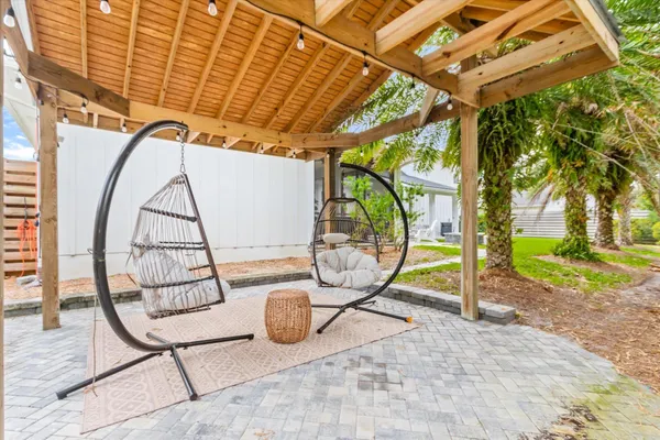 a view of a chairs and fire pit in the patio