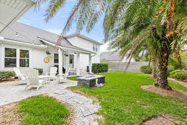 a view of an house with backyard porch and patio
